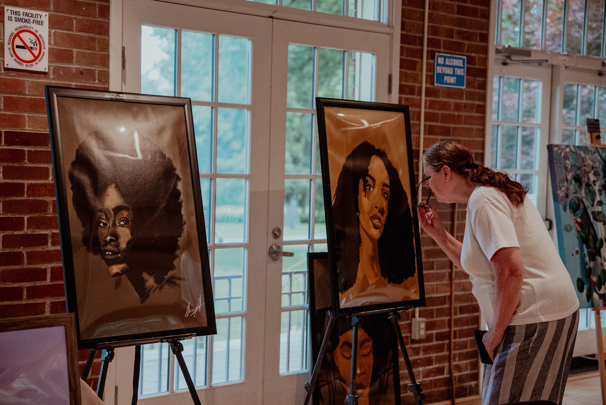 Artist painting on canvas at an event